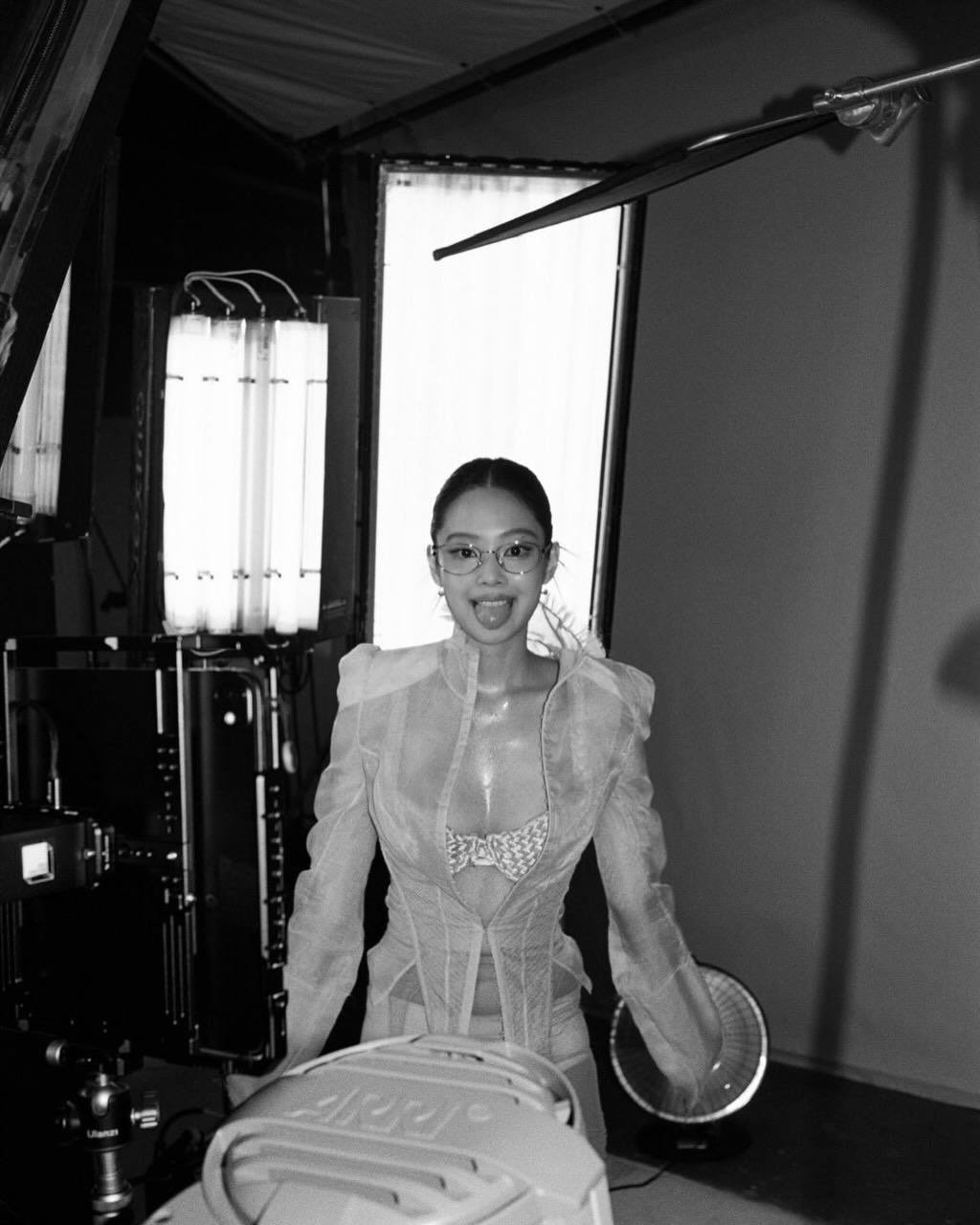 Photo shared by JENNIE BLACKPINK on April 10, 2026 tagging @blackpinkofficial, @jennierubyjane, and @lesyeuxdenini. May be a black-and-white image of one or more people, makeup, hair dryer, clothes iron, camcorder, camera and text.