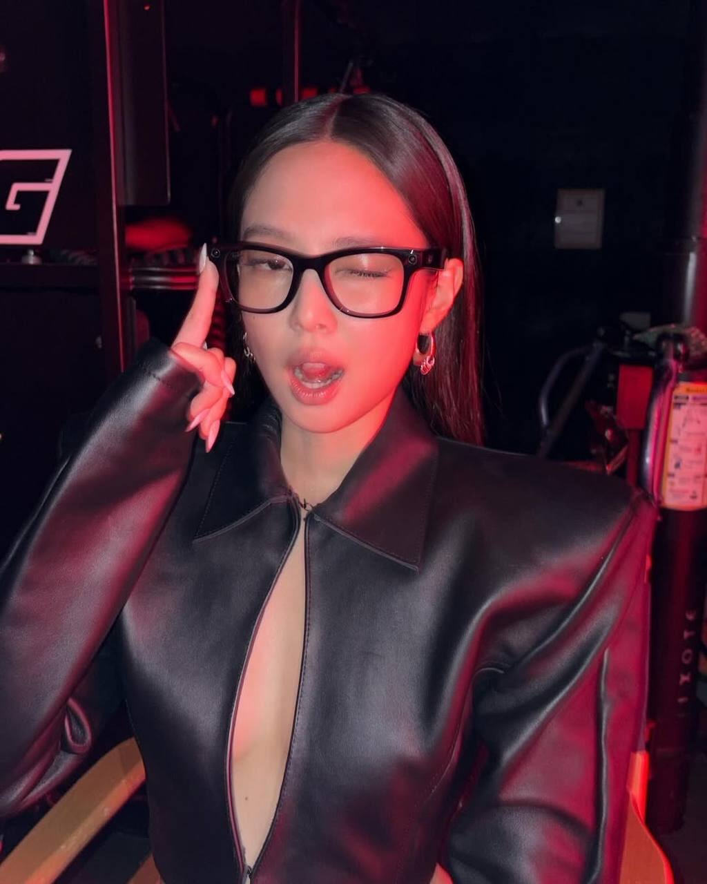 Photo shared by JENNIE BLACKPINK on April 21, 2026 tagging @blackpinkofficial, @jennierubyjane, and @lesyeuxdenini. May be an image of one or more people, hair, eyeglasses, top and text.