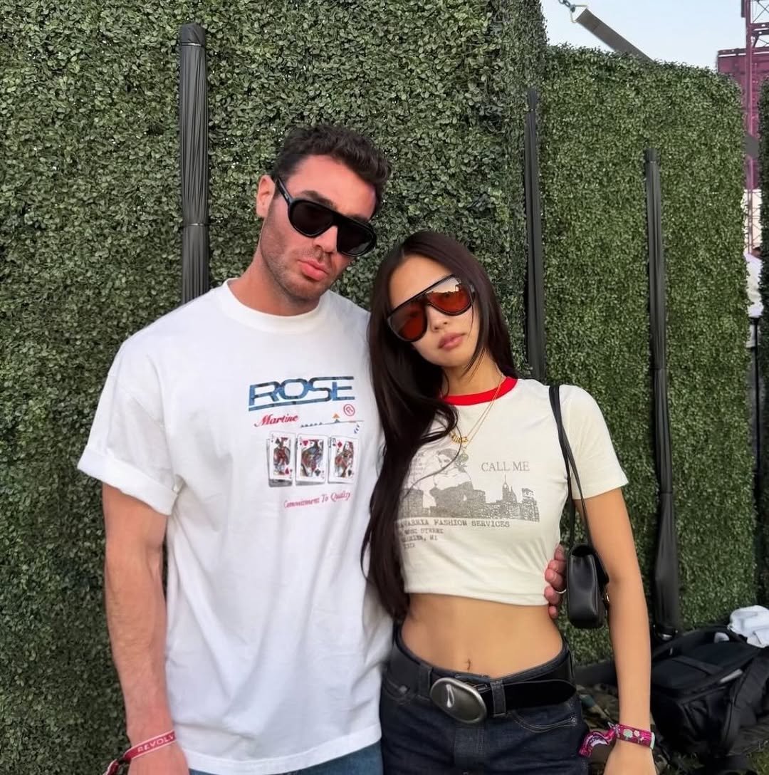 Photo shared by JENNIE BLACKPINK on April 12, 2026 tagging @sam__woolf, @blackpinkofficial, @jennierubyjane, and @lesyeuxdenini. May be an image of eyewear, miniskirt and text.