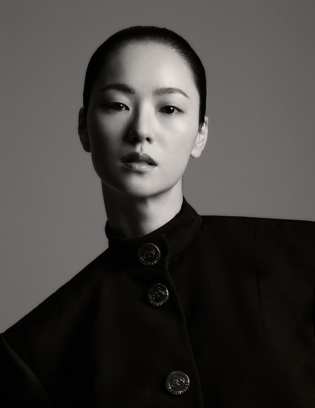 Photo shared by 전여빈 Yeobeen Jeon on January 26, 2026 tagging @ongibeauty, @stylist_boo, @ahnjooyoung_, and @kanghyunjin_official. May be a black-and-white image of one or more people, makeup, hair, overcoat, turtleneck and text.