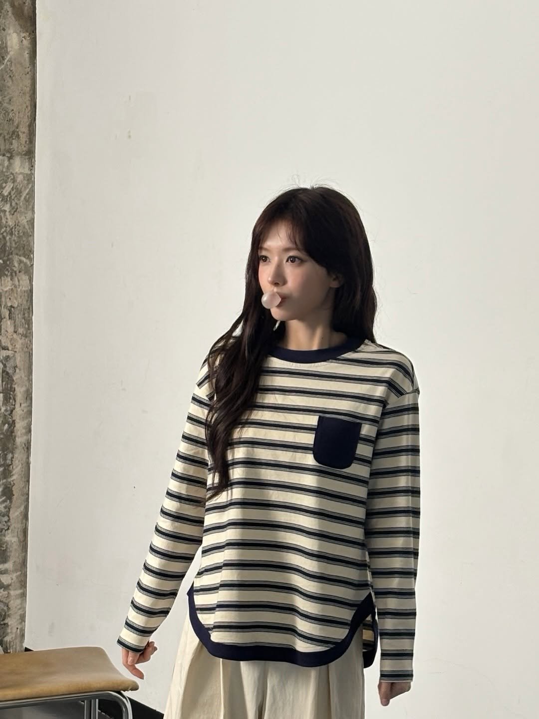 Photo by 노정의 on November 19, 2025. May be an image of top, cardigan and text.