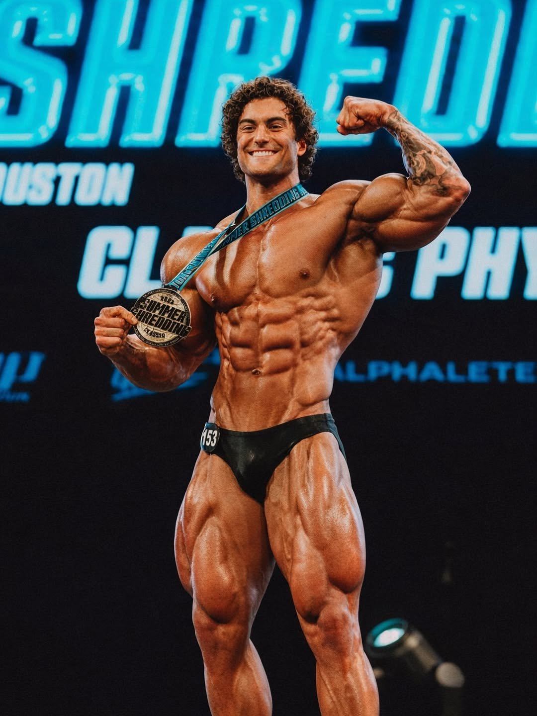 Photo by Jesse James West on December 22, 2025. May be an image of one or more people, biceps, people bodybuilding and text that says 'ኃጠ SHPEI PEU ΗΙ USTON CL j PH ਵੀਰਾ ! LPHALETE'.