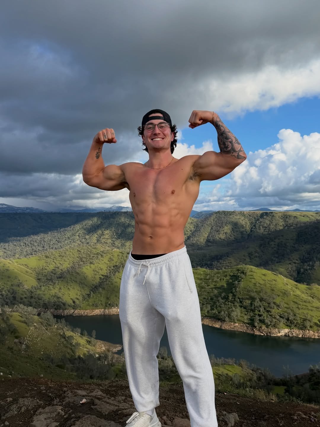 Photo by Jesse James West on February 21, 2026. May be an image of one or more people, biceps, people bodybuilding, sweatpants, outdoors and text.