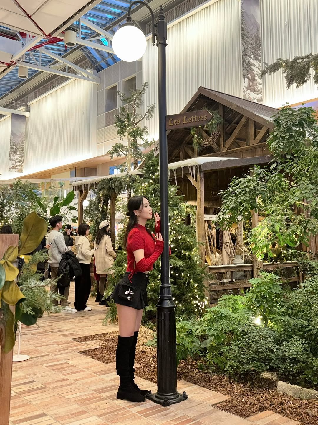 Photo by 김지원 on December 22, 2025. May be an image of lighting, miniskirt and text.