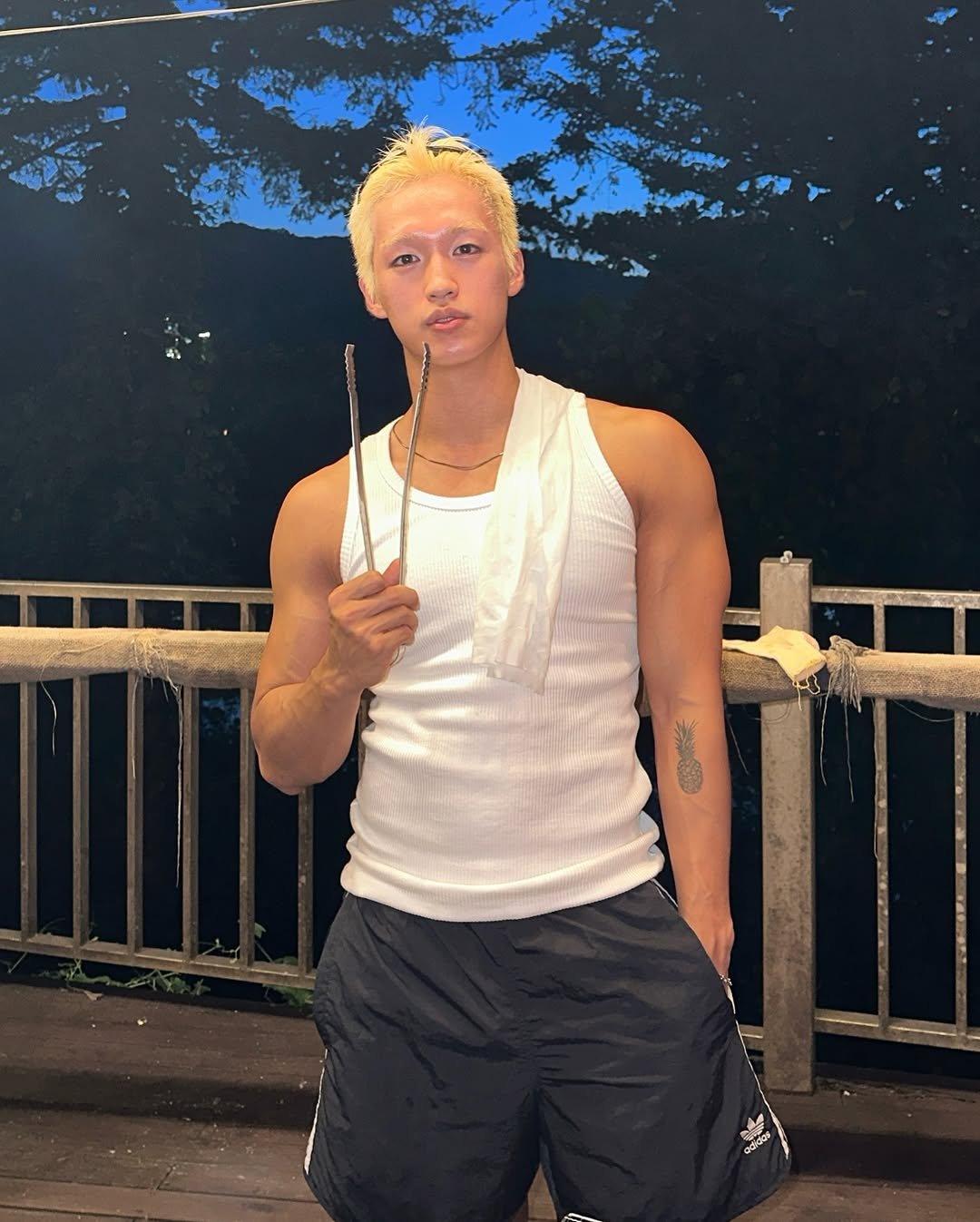 Photo shared by 지상근 / JIDAOL(지다올) on August 04, 2025 tagging @beavers_dock_. May be an image of 1 person, smoking, cigarette, tanktop and text.