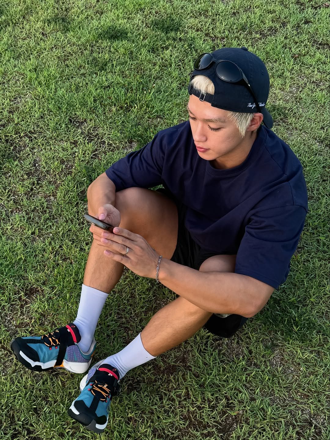 Photo shared by 지상근 / JIDAOL(지다올) on August 16, 2025 tagging @kream.co.kr, and @teva.korea. May be an image of 1 person, phone, sportswear, grass and text.