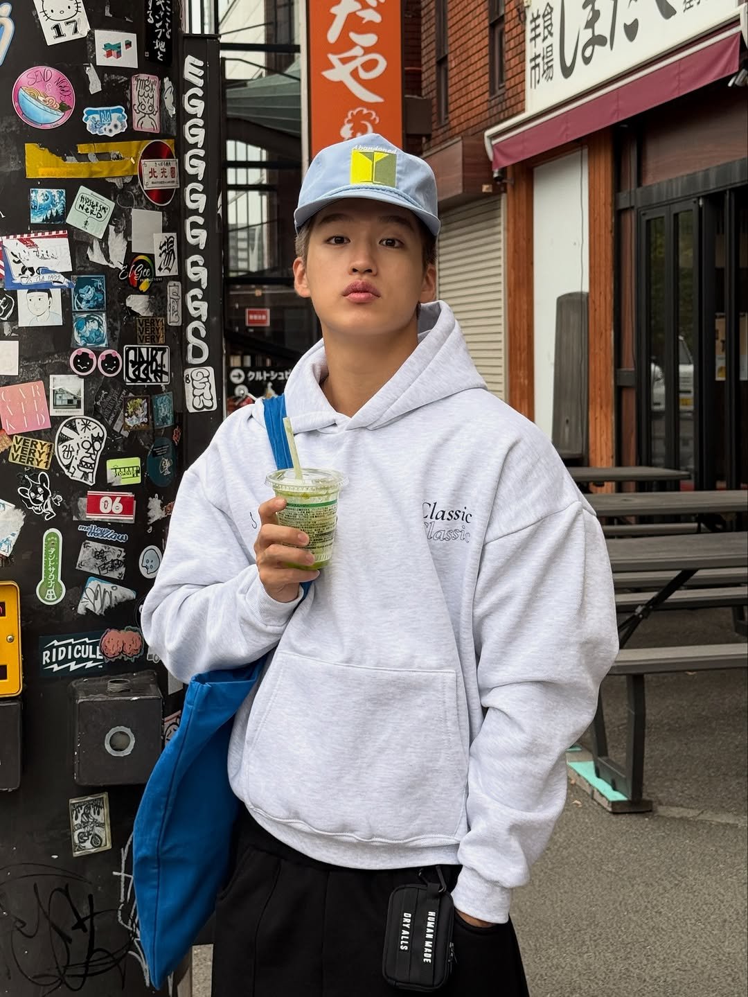 Photo shared by 지상근 / JIDAOL(지다올) on November 05, 2025 tagging @abandoned_martini. May be an image of hat, duffle coat, parka, sweatpants, sportswear, cornflower, street and text.