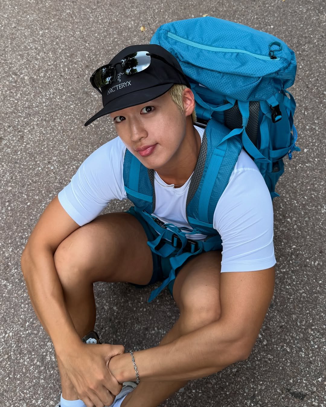 Photo shared by 지상근 / JIDAOL(지다올) on July 28, 2025 tagging @rusticpathways. May be an image of 1 person, activewear, hat, sportswear, sling, shorts, outdoors and text that says '3 RC'TERYX'.