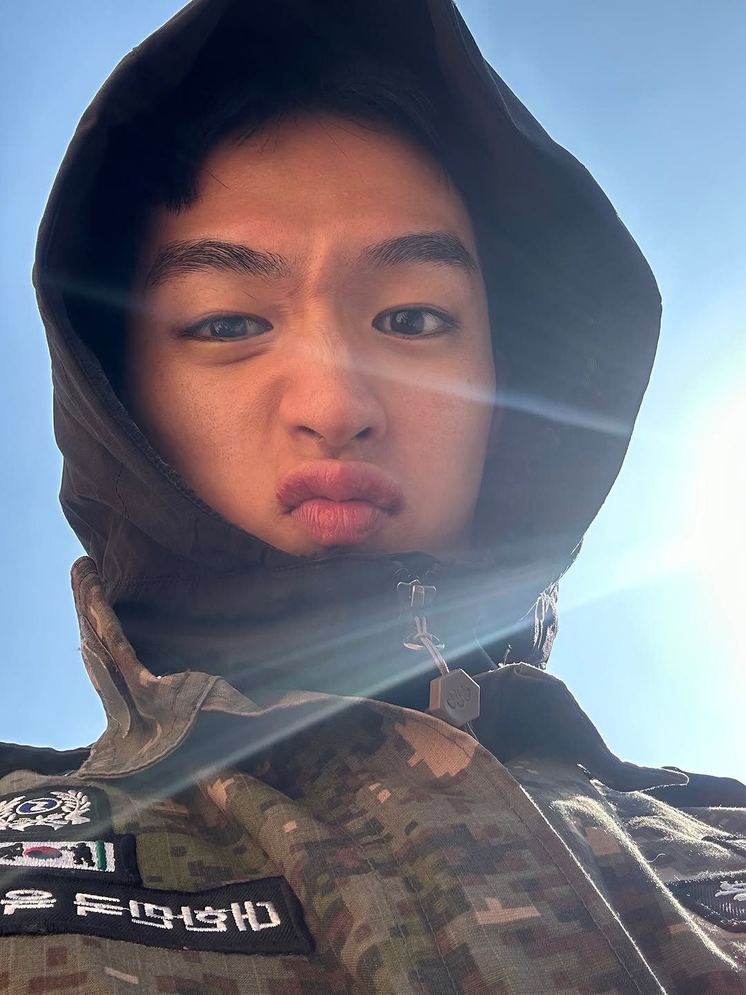 Photo by 지상근 / JIDAOL(지다올) on November 12, 2025. May be an image of one or more people, jacket, face mask, military uniform, cloak, parka and text.