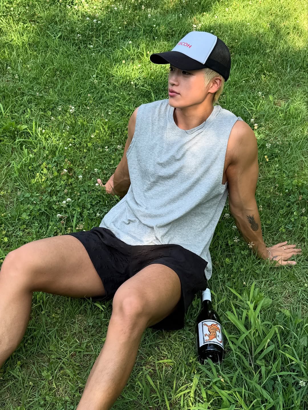 Photo by 지상근 / JIDAOL(지다올) on September 02, 2025. May be an image of 1 person, tanktop, shorts, water bottle, grass and text.