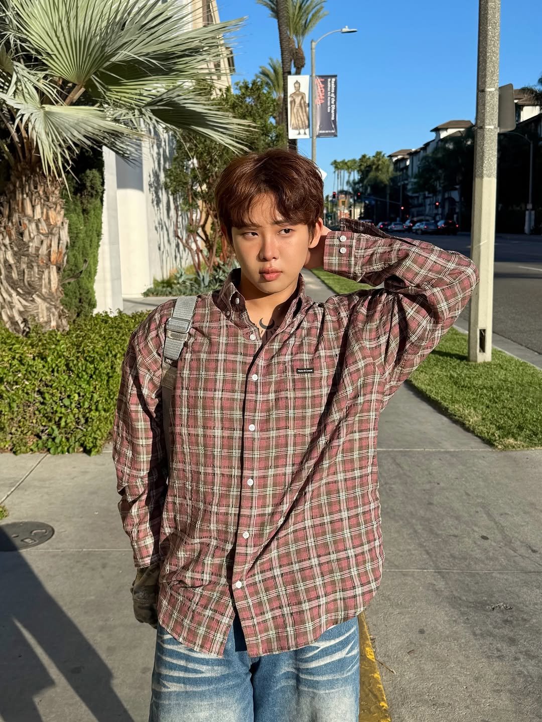 Photo by 잽잽 • Jabb on October 20, 2025. May be an image of bolo tie, flannel and text.