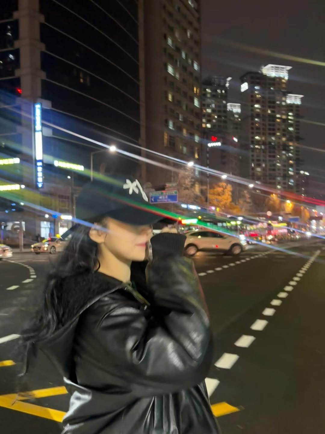 Photo by 백지헌 on November 29, 2025. May be an image of hat, street, night and text.