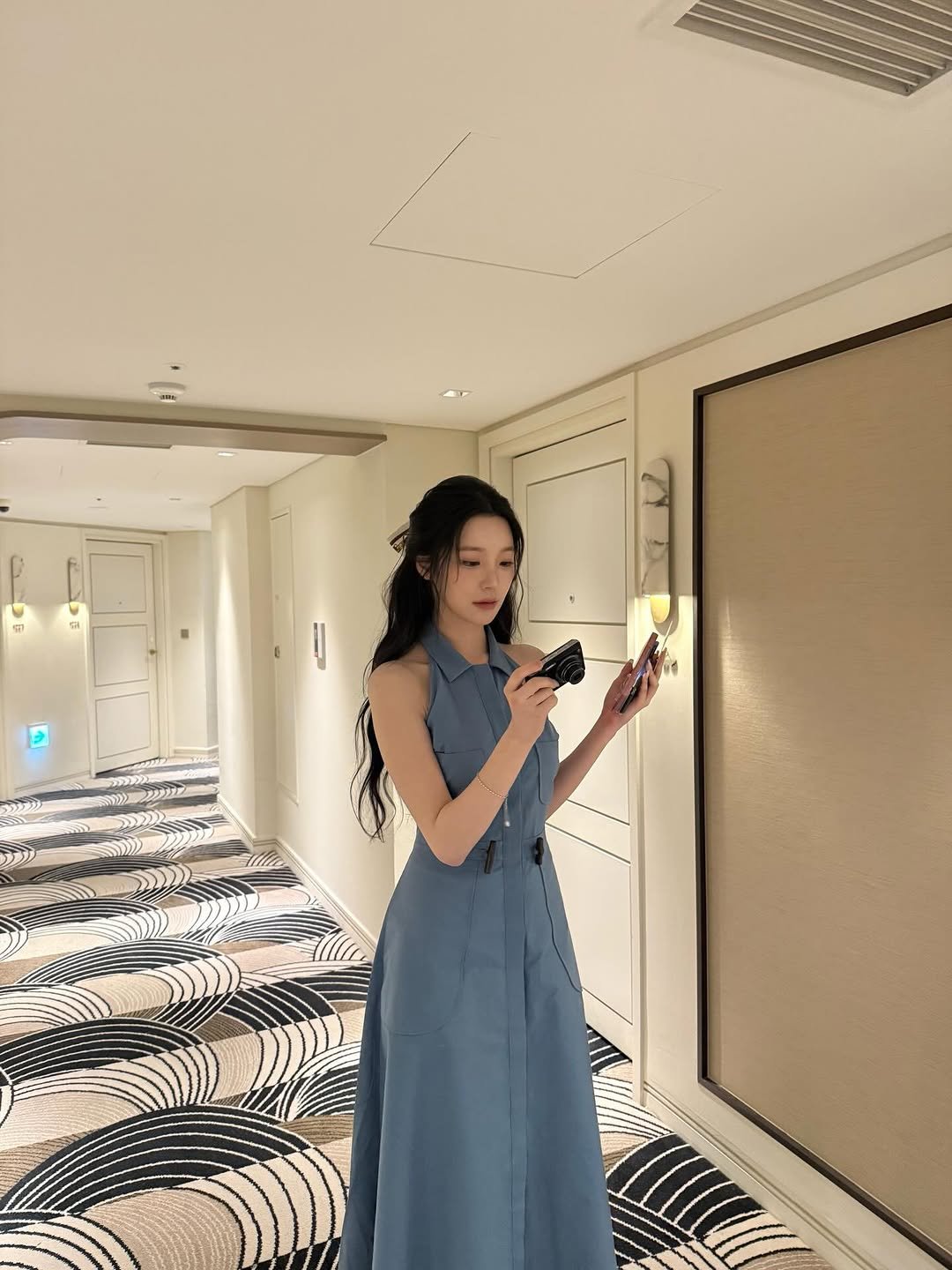 Photo by 백지헌 on April 10, 2026. May be an image of dress, hallway and text.