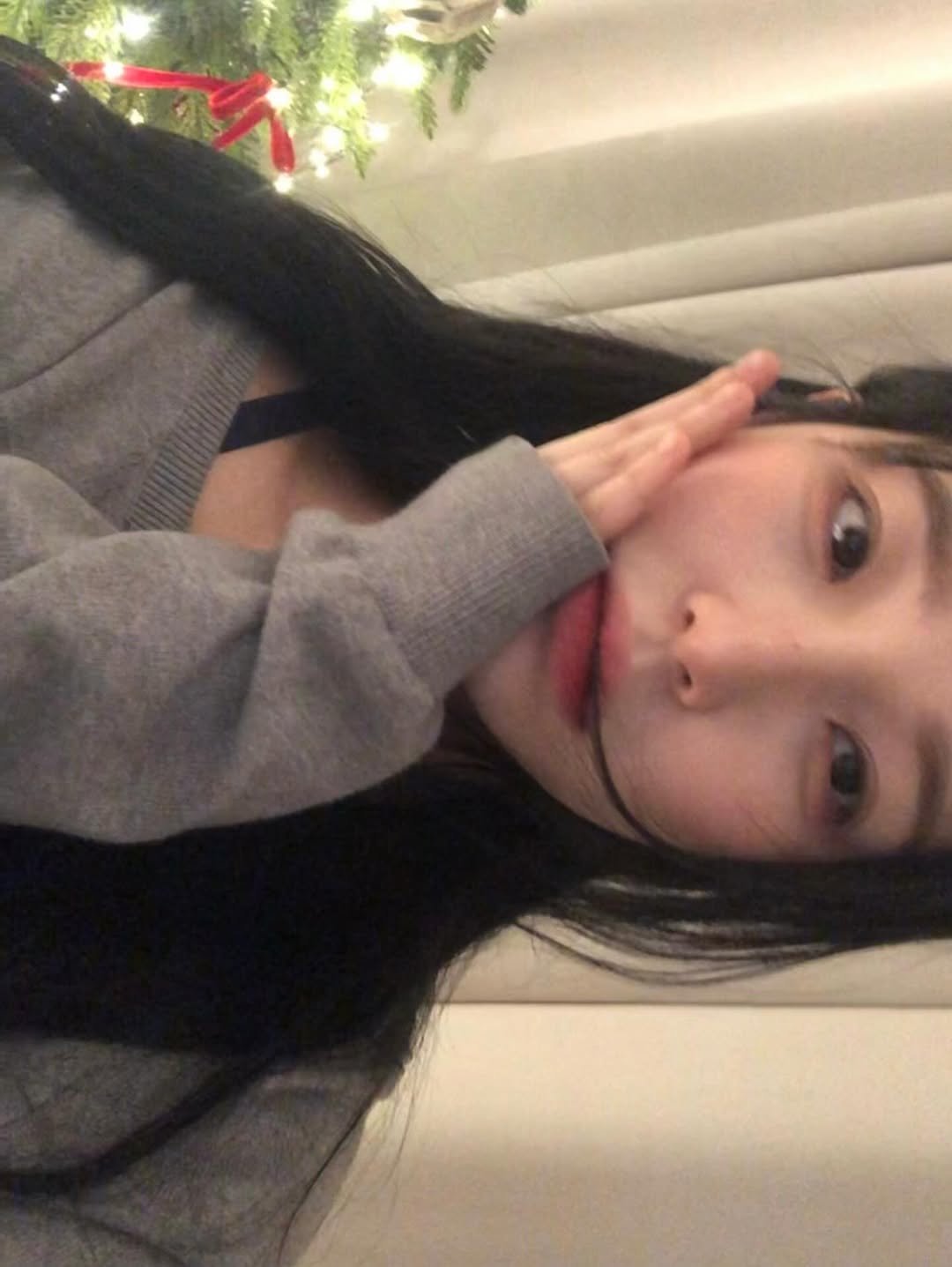 Photo by 백지헌 on December 30, 2025. May be a selfie of one or more people, hair, christmas tree, sweater and text.