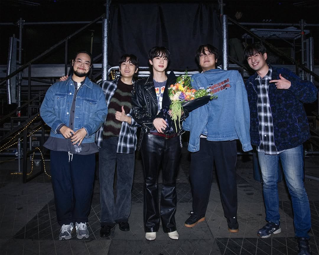 Photo by Jin of BTS on November 01, 2025. May be an image of one or more people, bangs, concert and text.