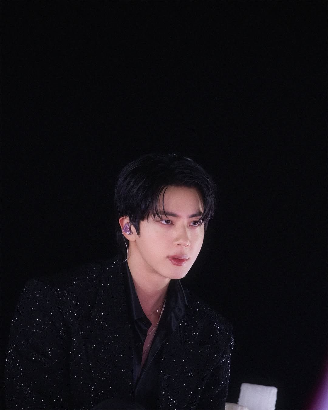 Photo by Jin of BTS on October 31, 2025. May be an image of bolo tie and text.