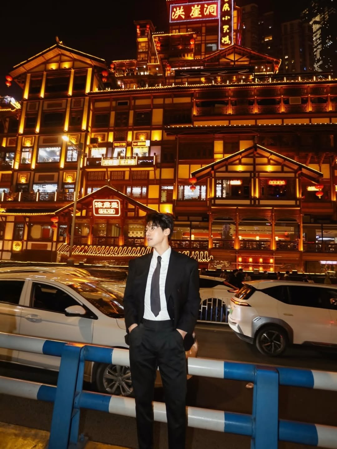 Photo by 张微笑 on February 19, 2026. May be an image of suit, night and text.