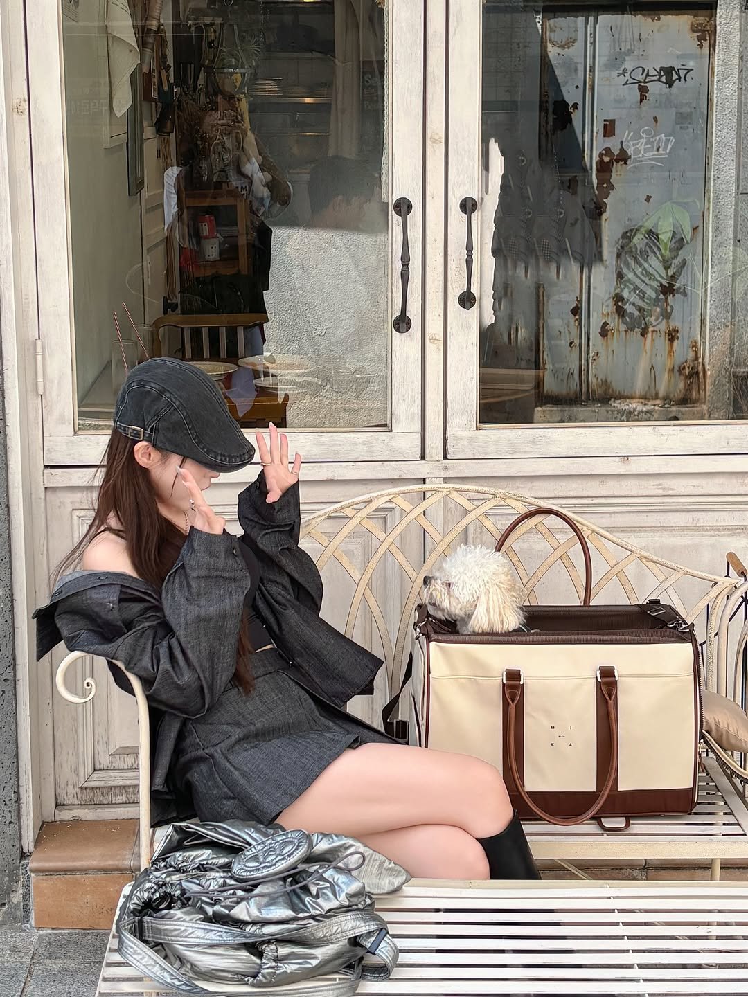 Photo by 진숭이🐒 on September 12, 2025. May be an image of 1 person, overcoat, suitcase and text.