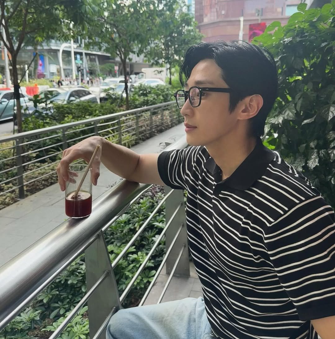 Photo by b1a4 jinyoung on March 13, 2026. May be an image of one or more people, hair, drink, cornflower and text.