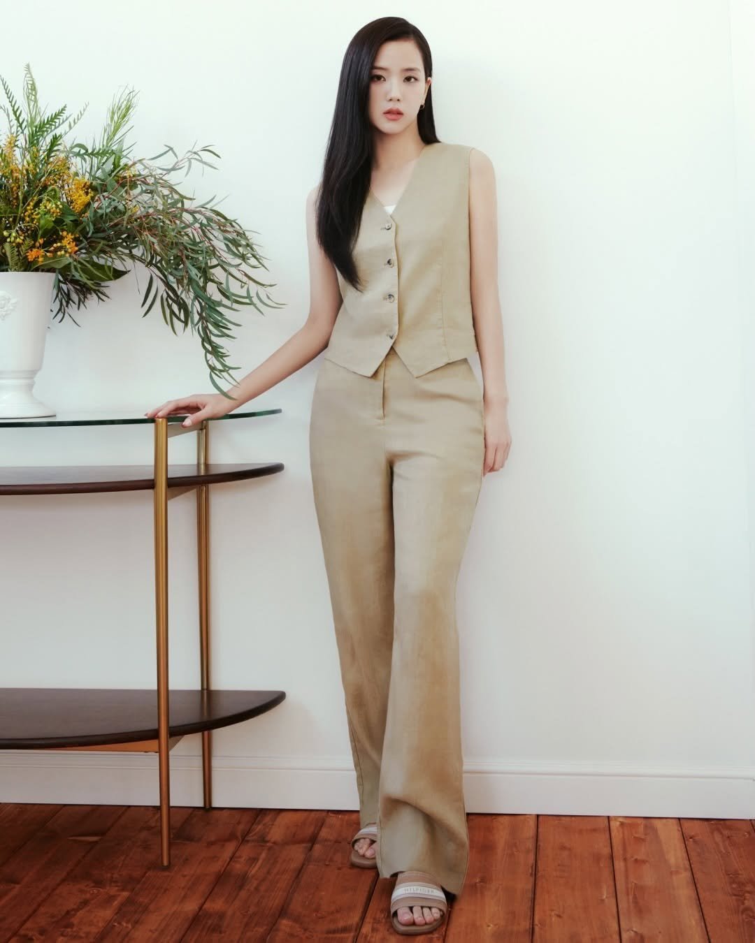 Photo shared by JISOO NEWS🪐 on March 04, 2026 tagging @tommyhilfiger, and @sooyaaa__. May be an image of sleepwear, jumpsuit and text.