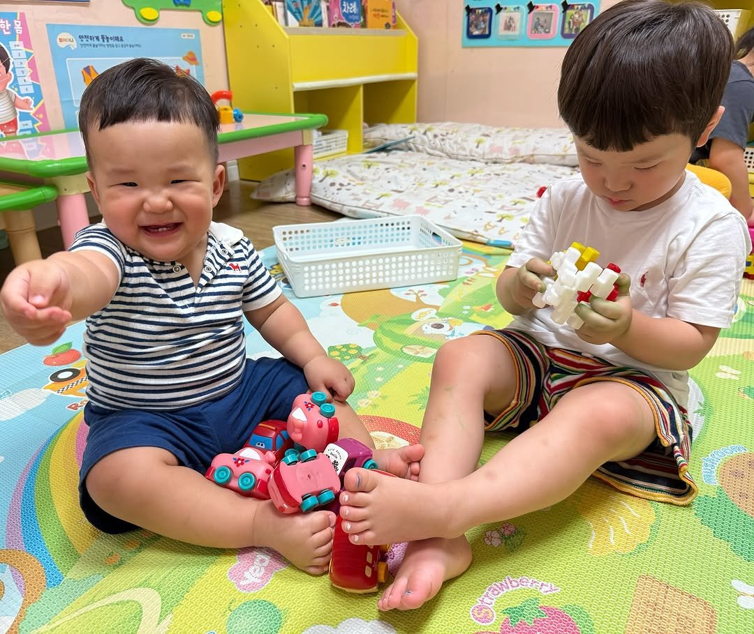 Photo by 이지수 유로단 on August 13, 2025. May be an image of 2 people, baby, lego and text.