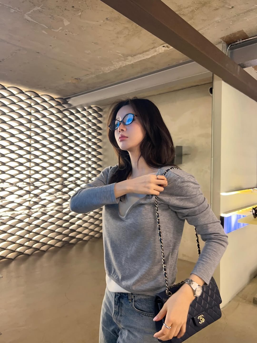 Photo shared by 지 원 on September 15, 2025 tagging @modiattico_official. May be an image of 1 person, eyewear, purse and text.