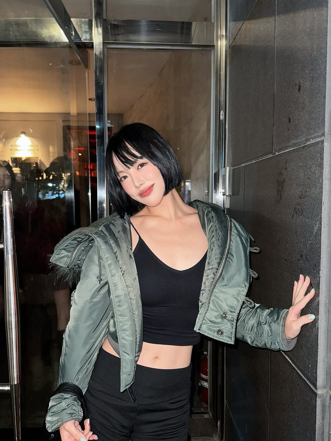 Photo by 지우렐라 on November 01, 2025. May be an image of fishnet stockings, miniskirt, jacket and text.