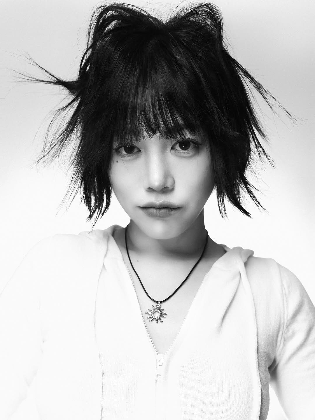 Photo shared by 지우렐라 on December 07, 2025 tagging @sunnytoffee. May be a black-and-white image of one or more people, bangs, braids, makeup, top and text.