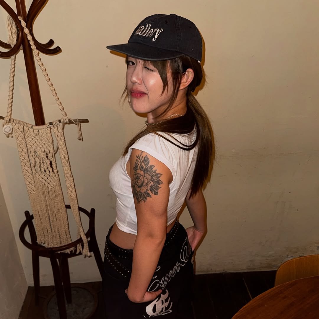 Photo shared by 지우렐라 on August 22, 2025 tagging @foam_normal. May be an image of 1 person, hair, hat, bolo tie, bowler hat, fishnet stockings and text.