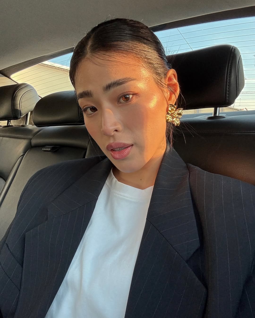 Photo by Jane Suhyun Lee on March 26, 2026. May be a selfie of one or more people, hair, makeup, blazer, suit, turtleneck and text.