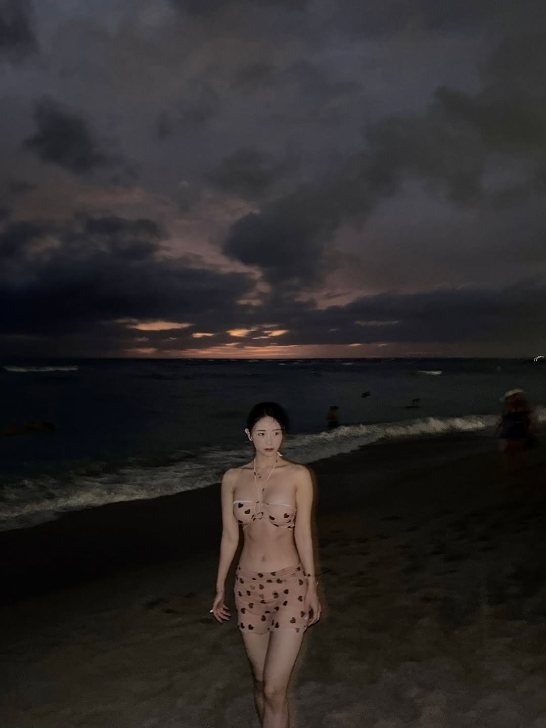 Photo by 영진 / 제니T on June 25, 2025. May be an image of 1 person, fishnet stockings, beach, twilight, ocean and text.