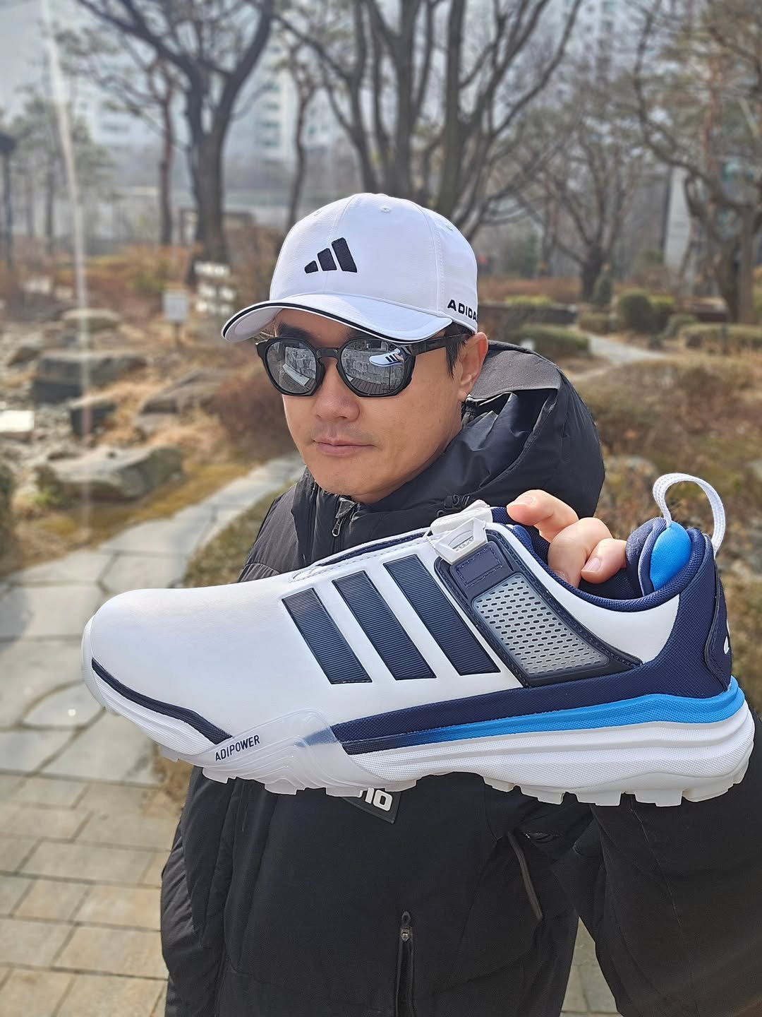 Photo shared by 신 정 균 on February 11, 2026 tagging @adidasgolf. May be an image of sportswear, sneakers, sports equipment and text that says 'ADIO bib III ADIPOWER'.