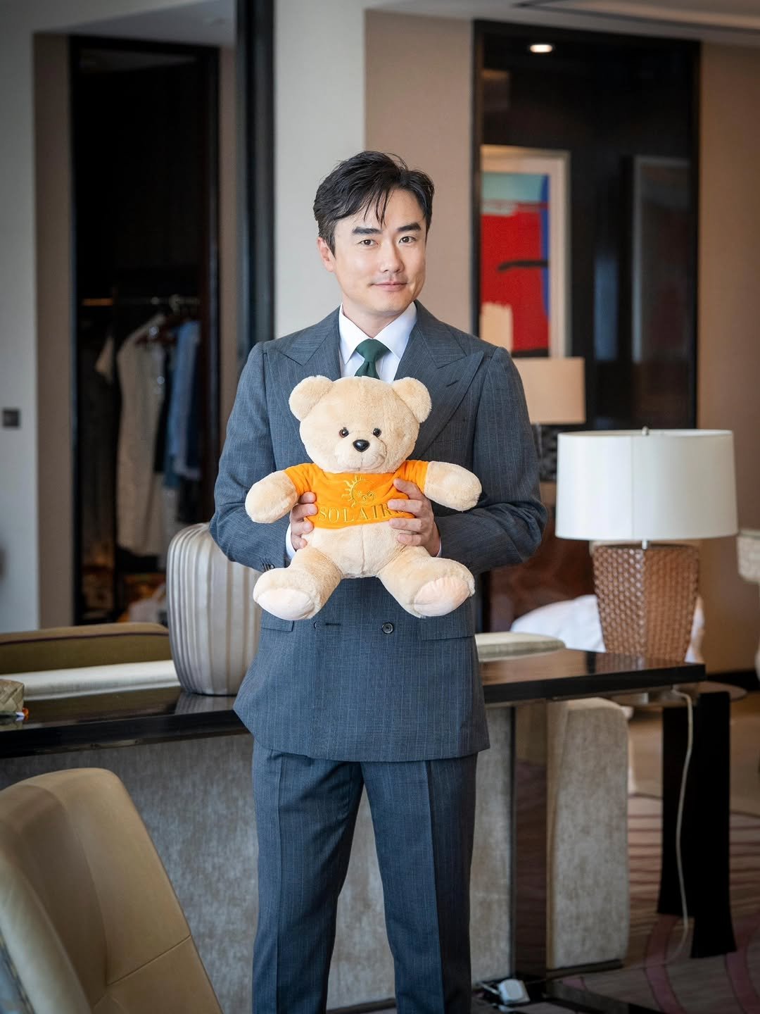 Photo shared by 신 정 균 on April 17, 2026 tagging @solaireresort. May be an image of suit, dinner jacket, blazer and text.