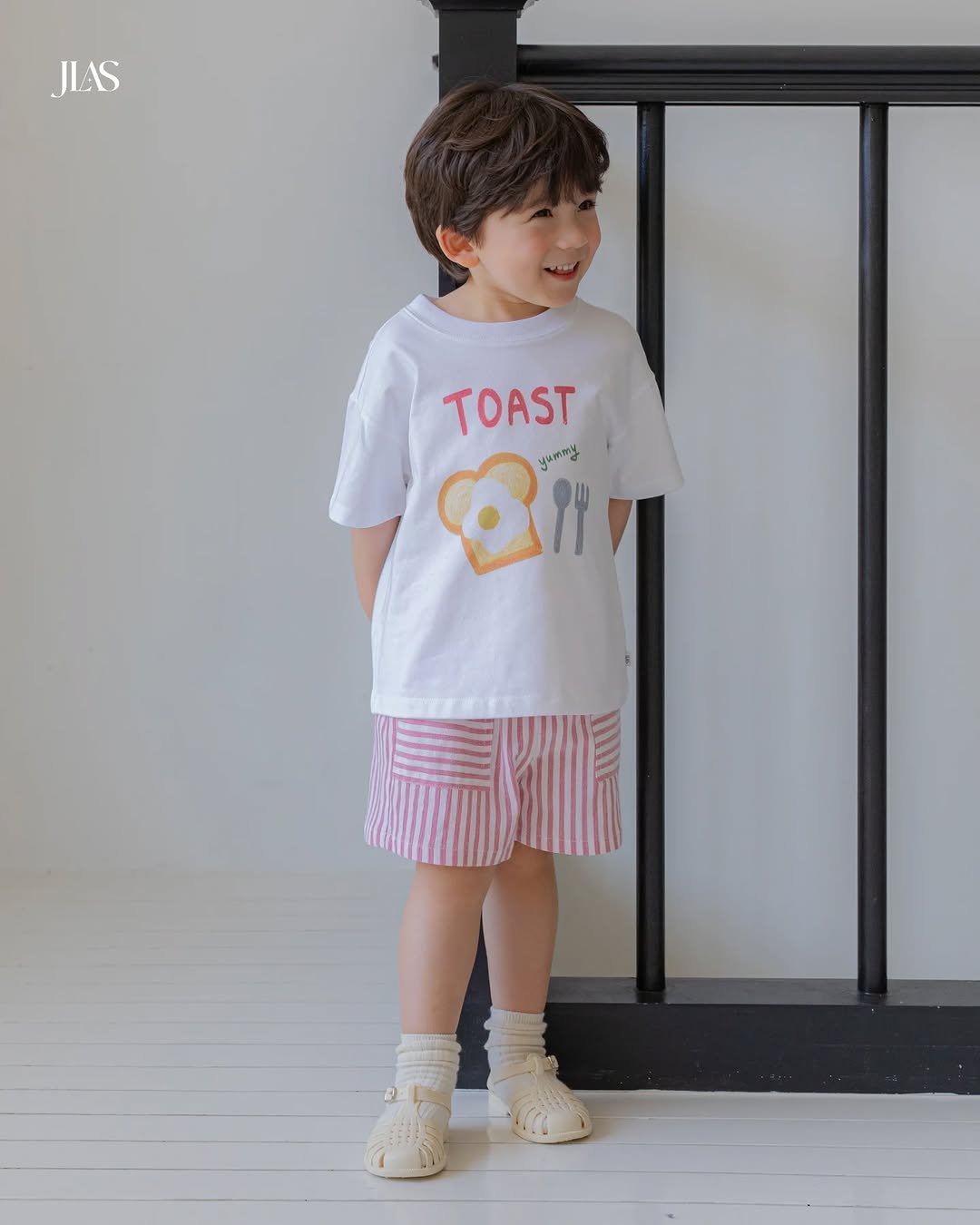 Photo by 제이라스 on April 28, 2026. May be an image of child, sleepwear, shorts and text that says 'JLAS JLAS TOAST yummy 94'.