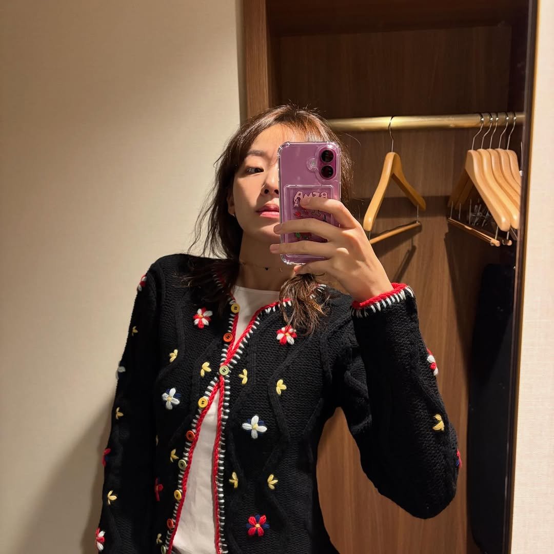 Photo shared by 이주명 on January 09, 2026 tagging @tach_clothing. May be an image of blazer, clothes hanger, cardigan, top, sweater and text.