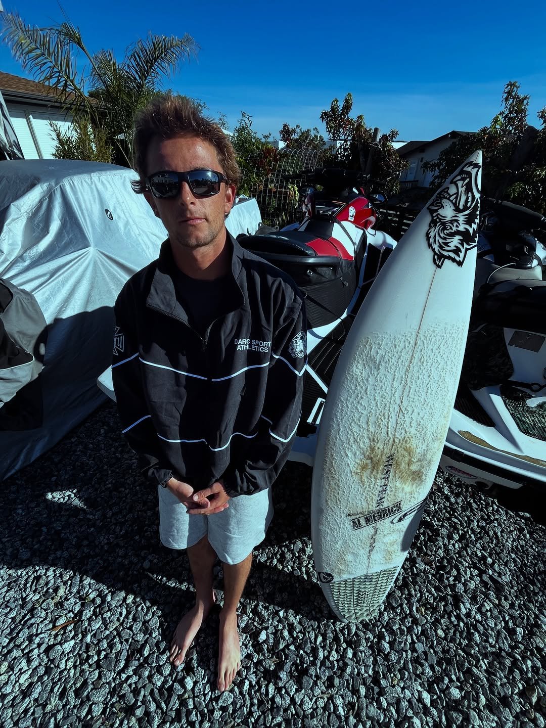 Photo shared by John Mel on November 25, 2025 tagging @darcsportathletics. May be an image of surfboard, skateboard, wetsuit, glasses, water and text.