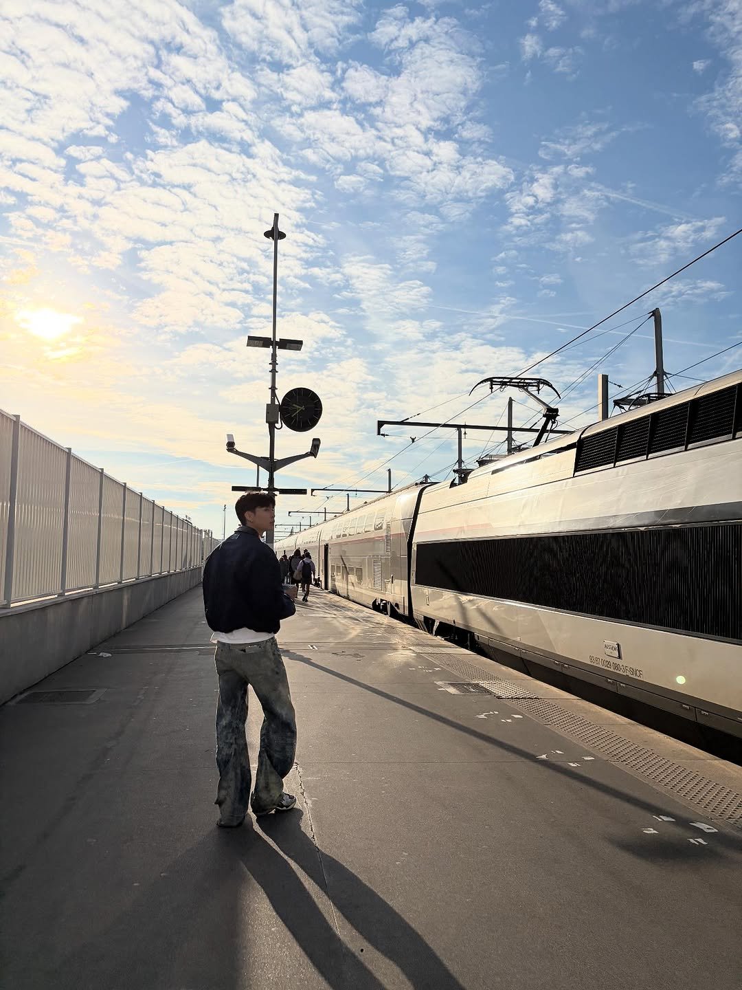 Photo by Johnny Suh on October 03, 2025. May be an image of 3 people, segway, skateboard, train, street and railroad.