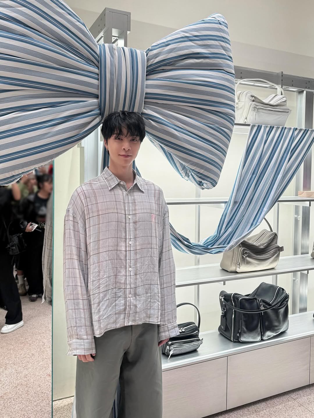 Photo shared by Johnny Suh on December 14, 2025 tagging @acnestudios. May be an image of neckwear and text.