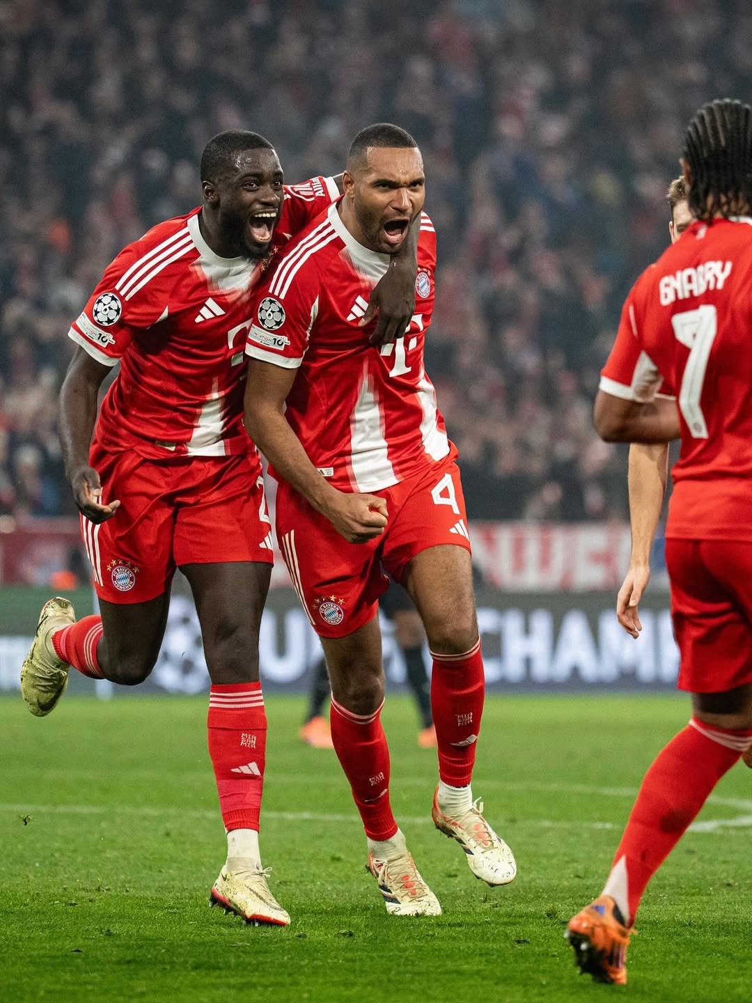 Photo shared by Jonathan Tah on December 09, 2025 tagging @sergegnabry, and @upamecano. May be an image of football, soccer, stadium and text that says '-1မ τΩ- SANY wει CHAMI'.