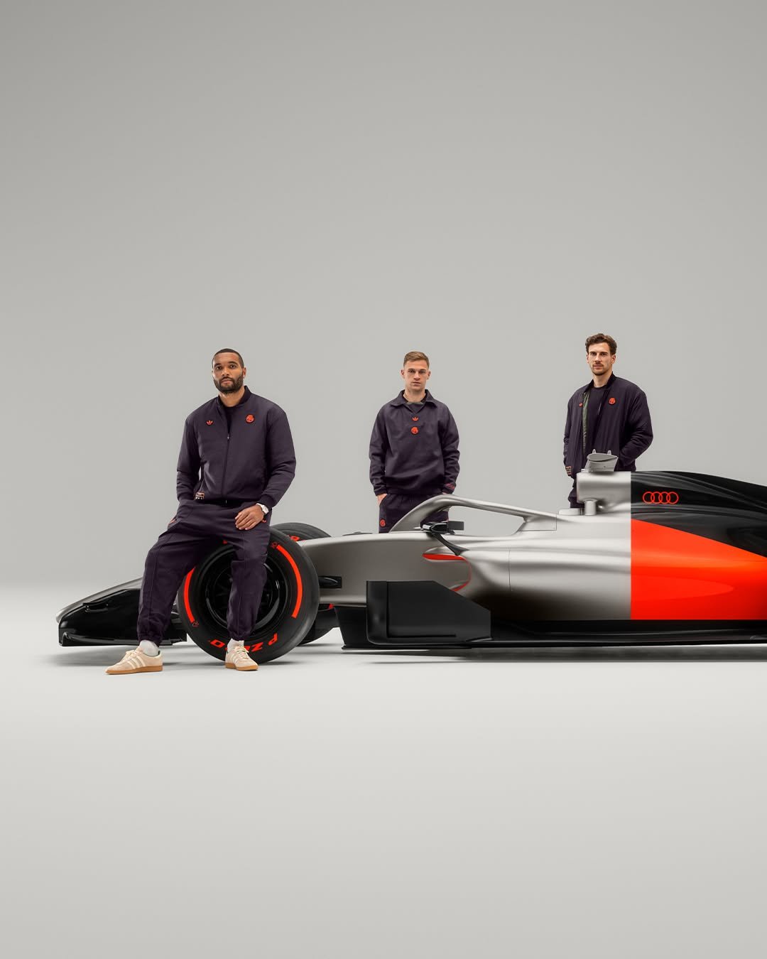 Photo shared by FC Bayern on November 19, 2025 tagging @jonathantah, @leon_goretzka, @joshua.kimmich, and @audif1. May be an image of racing vehicles, race car and text.