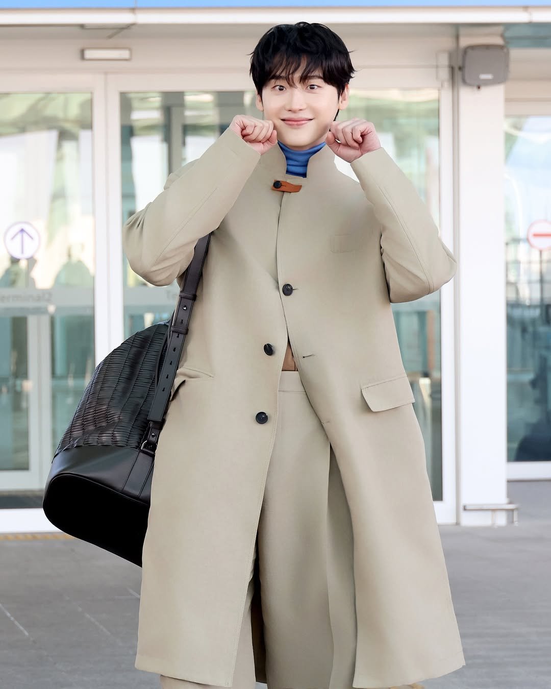 Photo shared by 이종석 on February 26, 2026 tagging @ferragamo. May be an image of duffle coat, overcoat, parka and text.