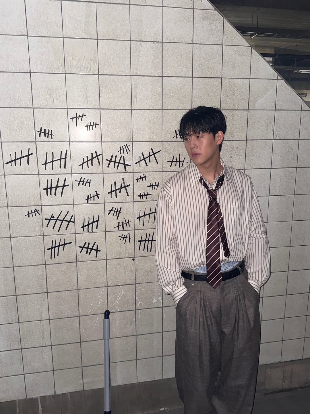 Photo by 주헌 joohoney on December 26, 2025. May be an image of wingtip shoes, bolo tie, suit and text.
