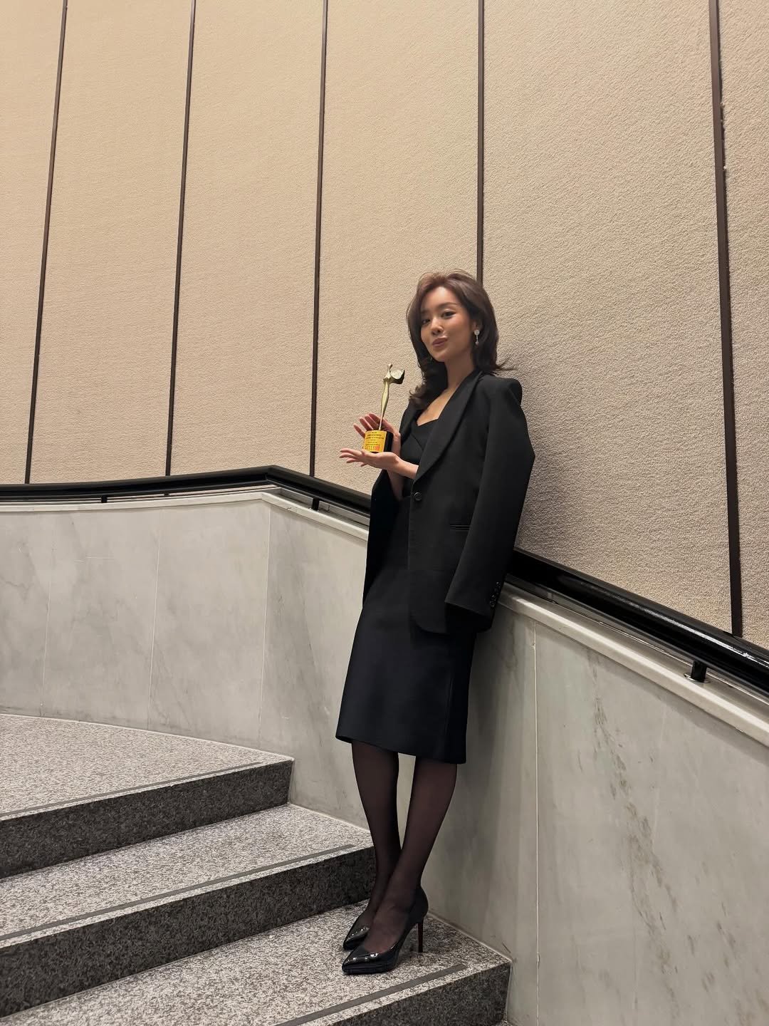 Photo by 차주영 Cha Joo Young on December 10, 2025. May be an image of suit, blazer and text.