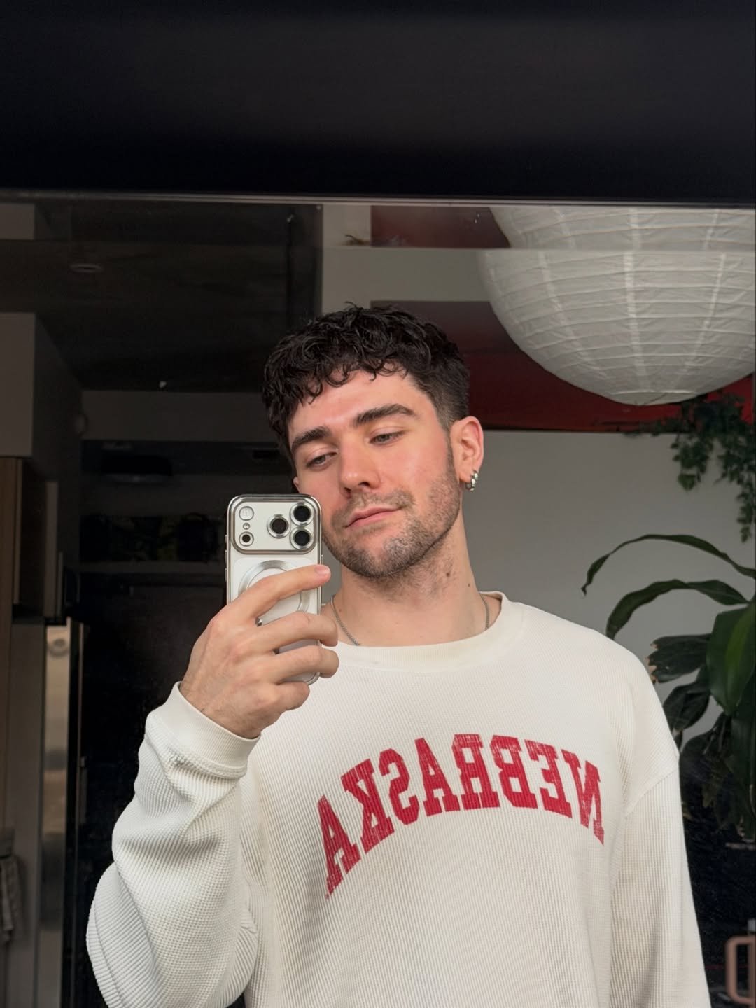 Photo by Jordan Watkins on February 24, 2026. May be a selfie of one or more people, hair, mirror, sweater, turtleneck, sweatshirt and text.