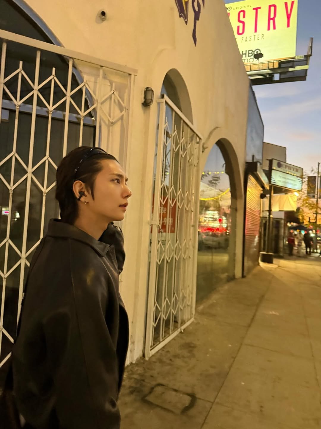 Photo by Joshua Hong on January 14, 2026. May be an image of standing, cigarette, signboard and text.