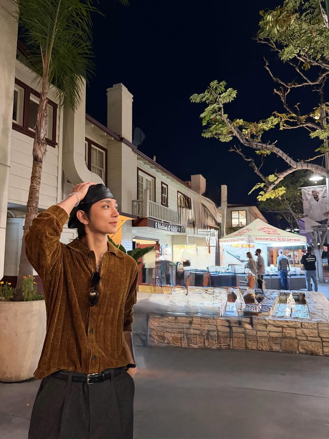 Photo by Joshua Hong on November 08, 2025. May be an image of bolo tie, night and text.