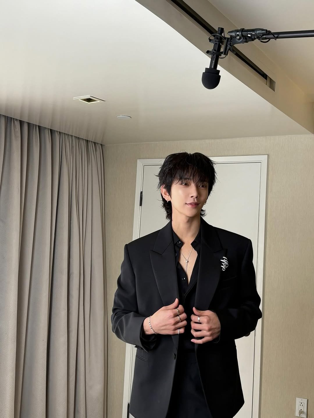 Photo by Joshua Hong on January 13, 2026. May be an image of suit, bolo tie, blazer and text.