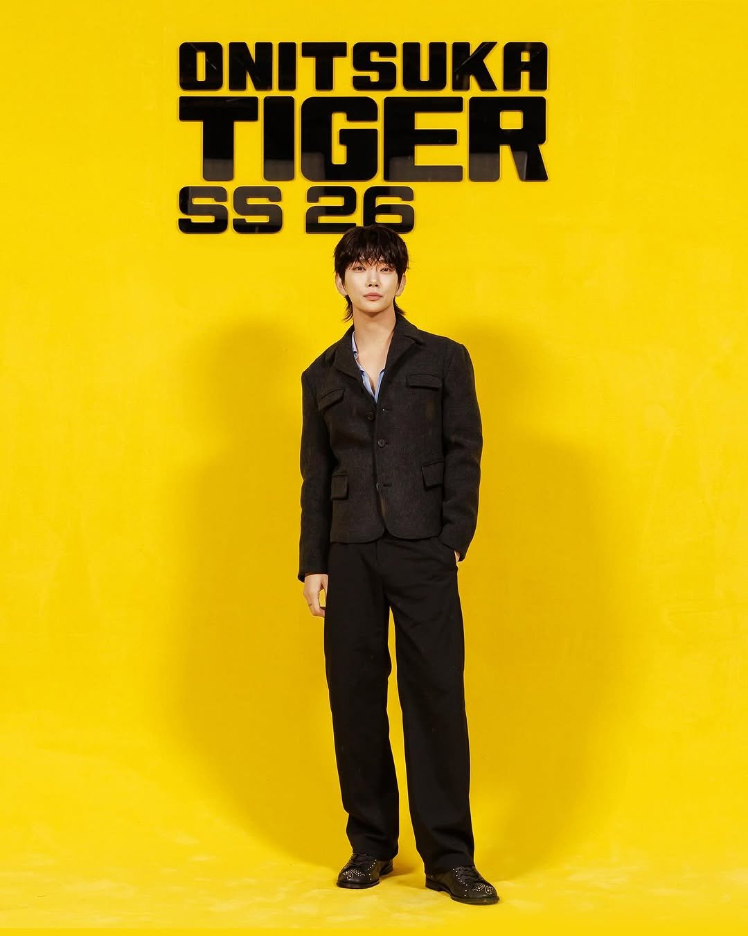 Photo shared by Joshua Hong on September 26, 2025 tagging @onitsukatigerofficial, and @onitsukatigerkr. May be an image of 1 person and text that says 'DNITSUKA TIGER SS 26'.