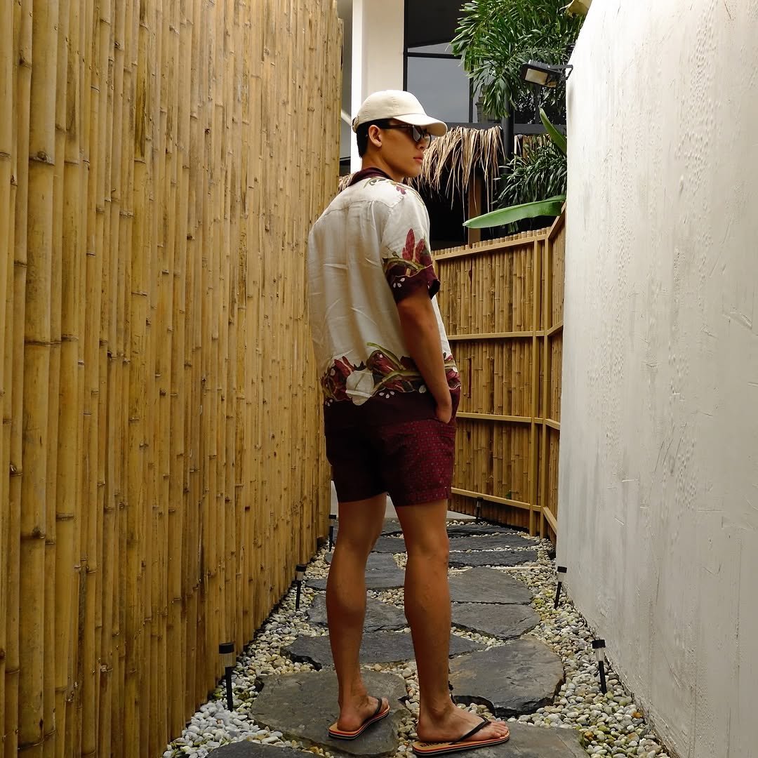 Photo shared by Joss Way-Ar Sangngern. on November 04, 2025 tagging @orlebarbrown, and @orlebarbrownthailand. May be an image of shorts, bamboo, outdoors, hallway and text.