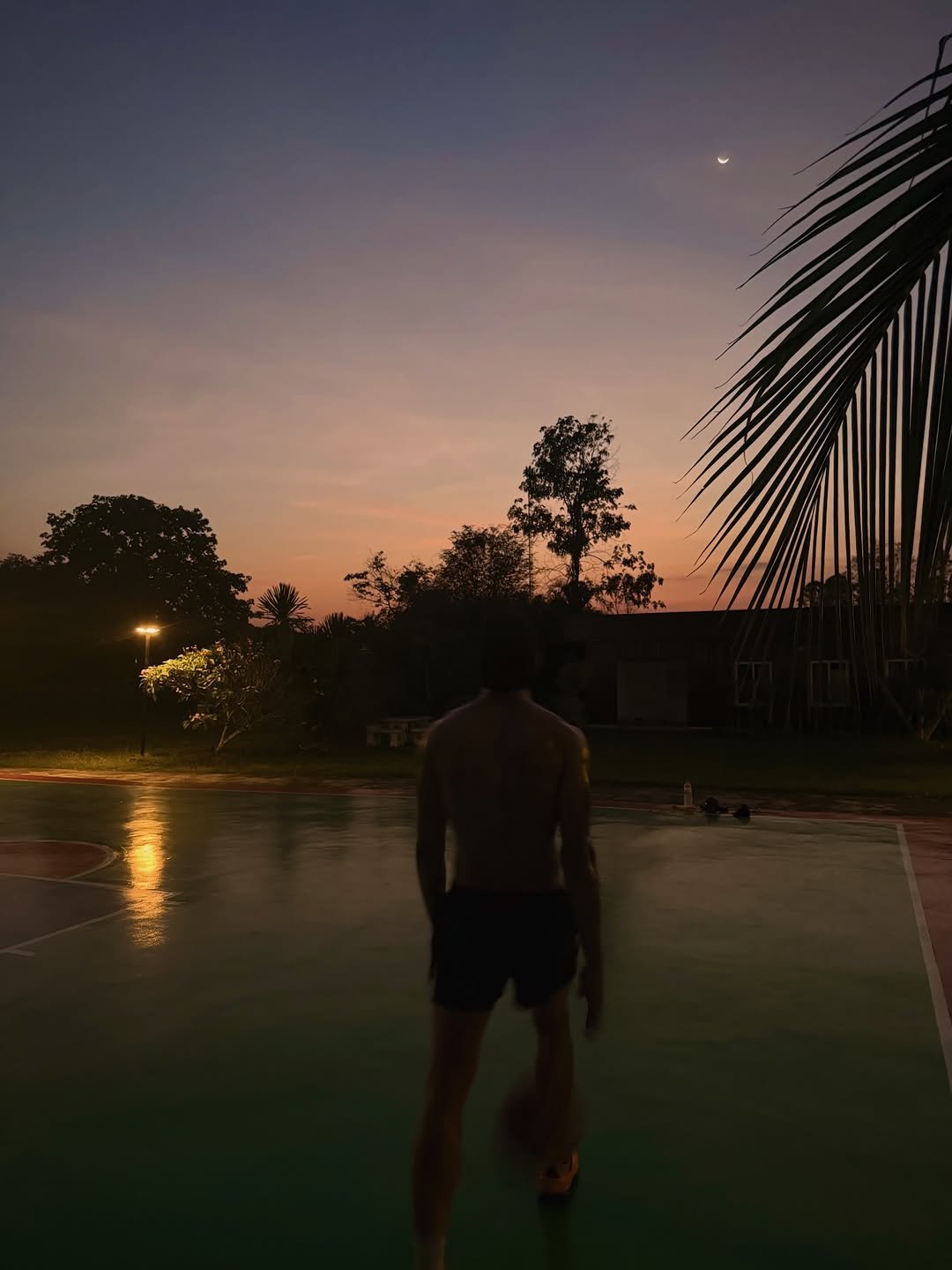 Photo by Joss Way-Ar Sangngern. on February 20, 2026. May be an image of basketball, twilight, eclipse, pool, basketball court, night, palm trees and text.